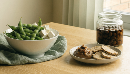 Side-by-side comparison of unfermented soy foods like edamame and tofu with fermented miso and tempeh